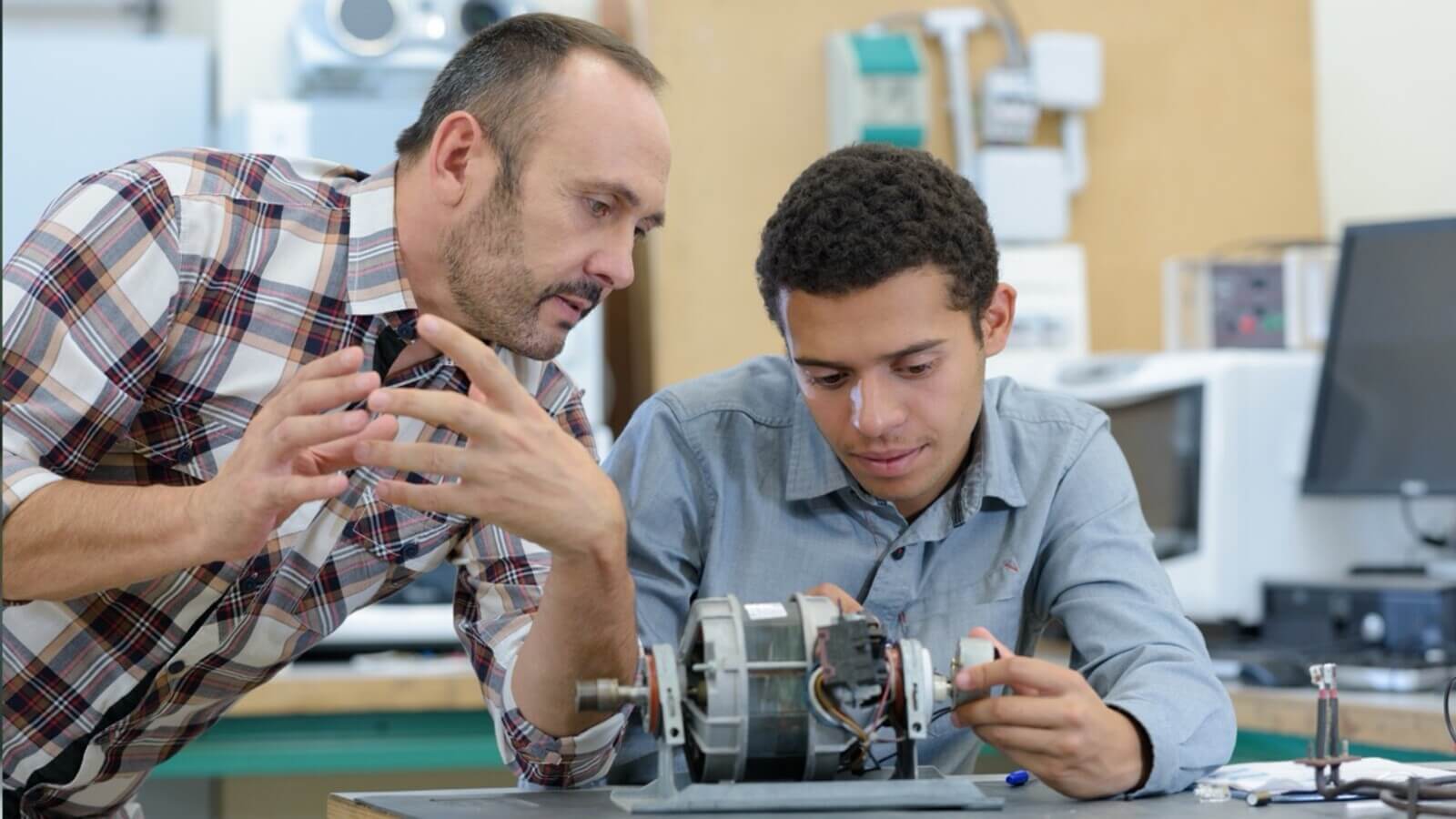College engineering student works on project with their professor