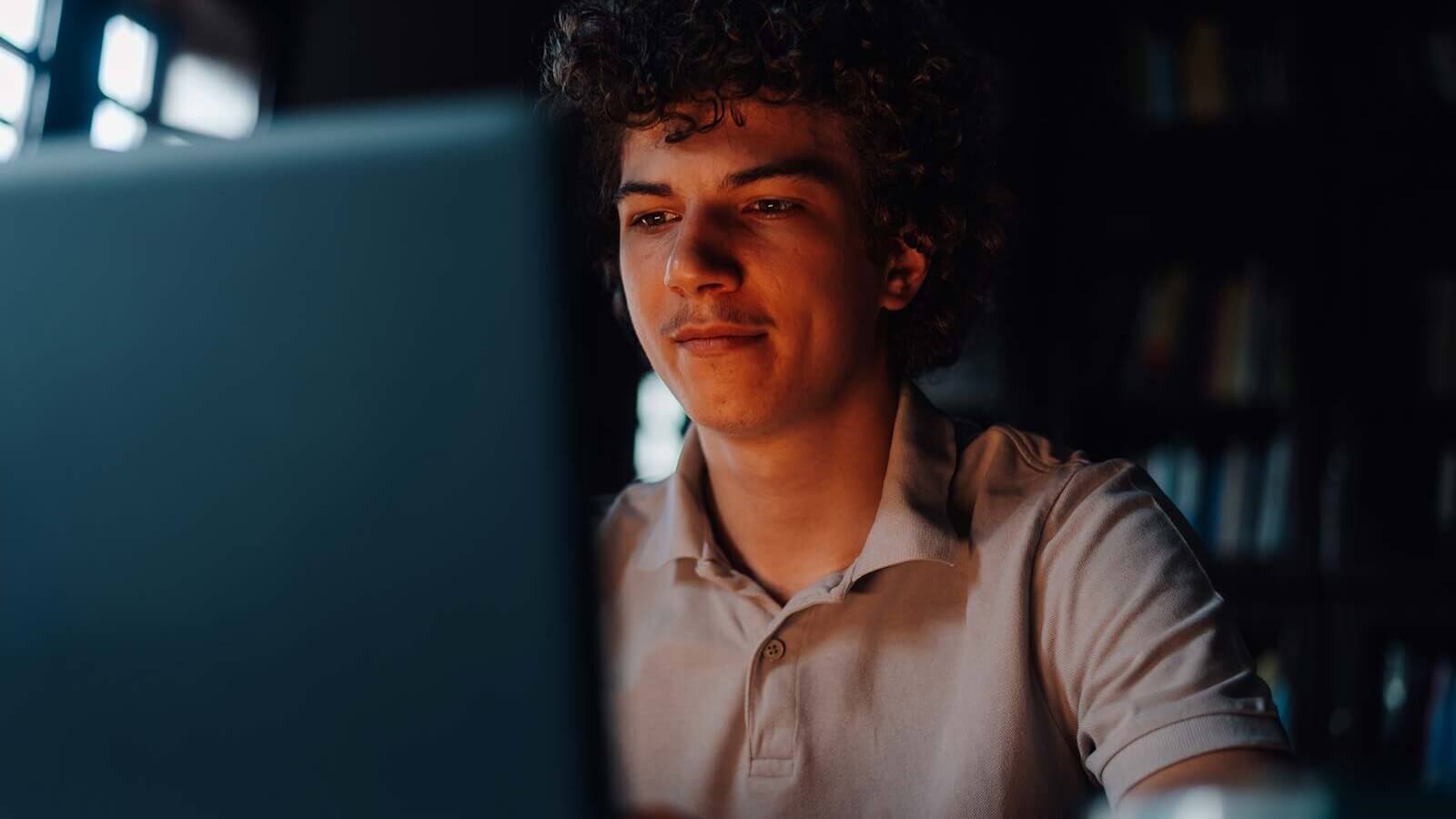 a student looks at his laptop