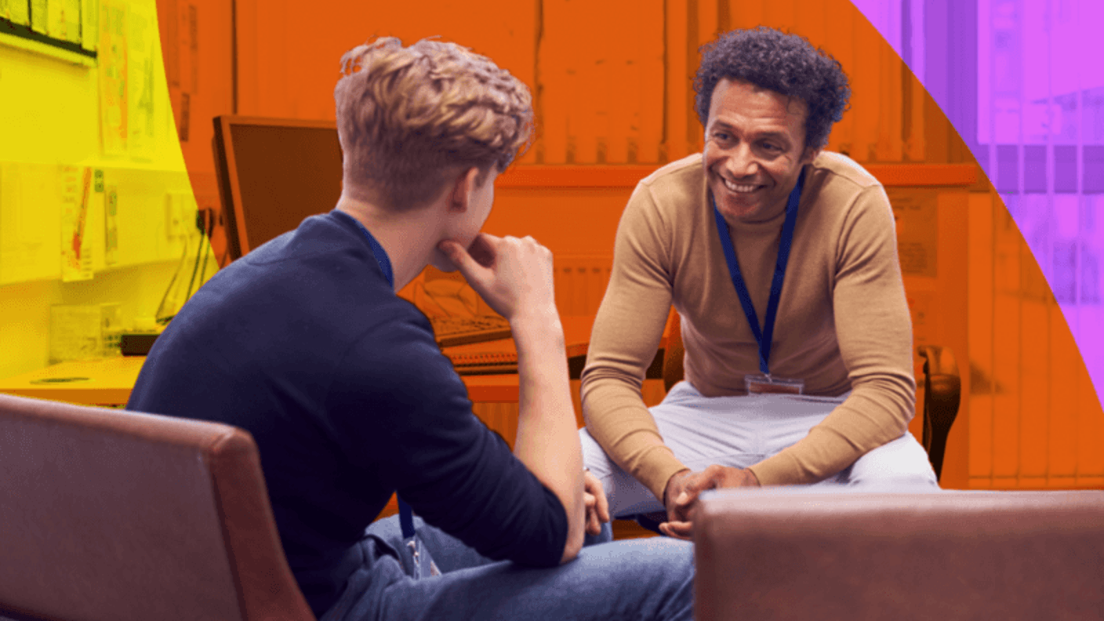 a student chats with a high school counselor