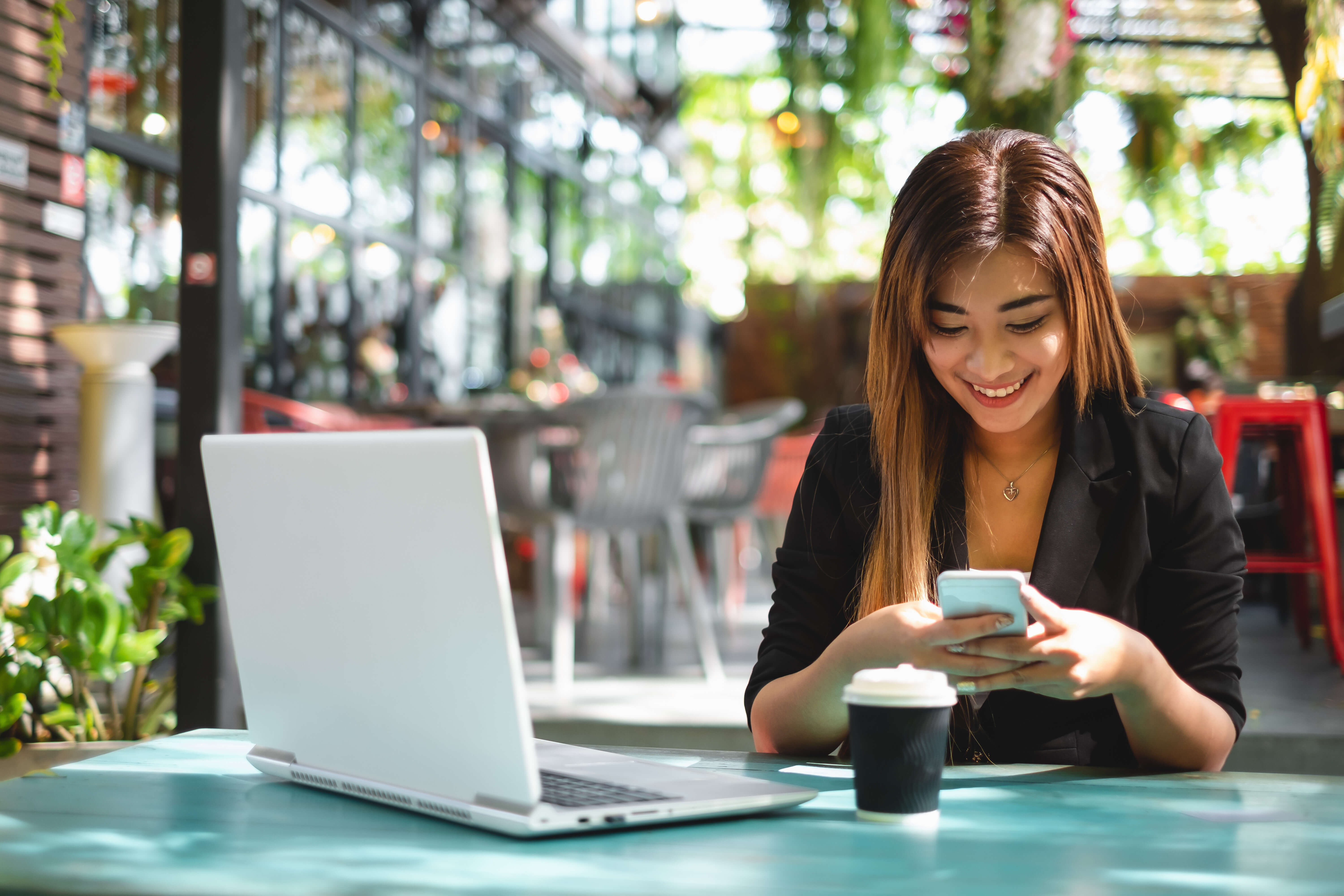 Student looks excitedly at phone