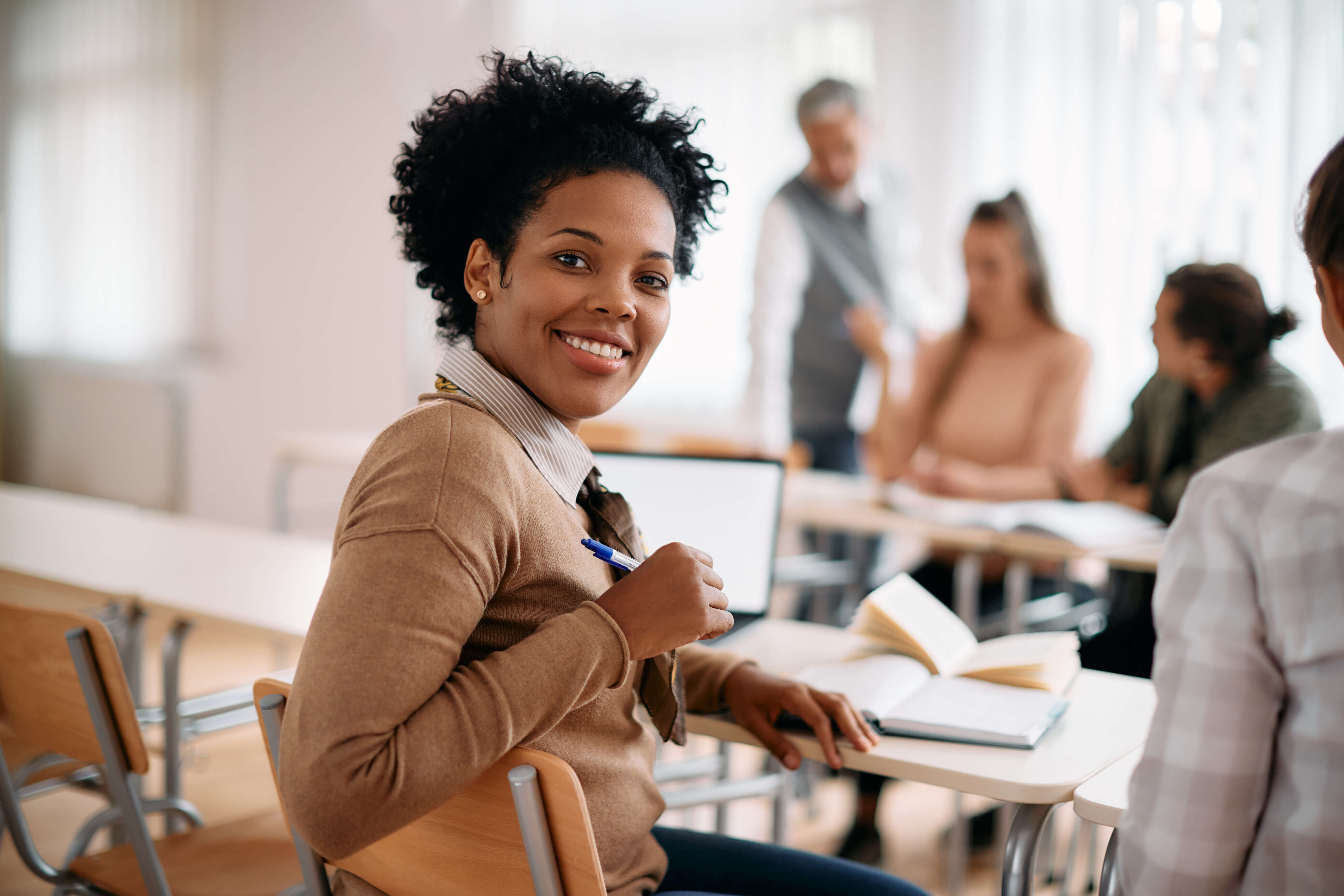 Student smiles at the camera