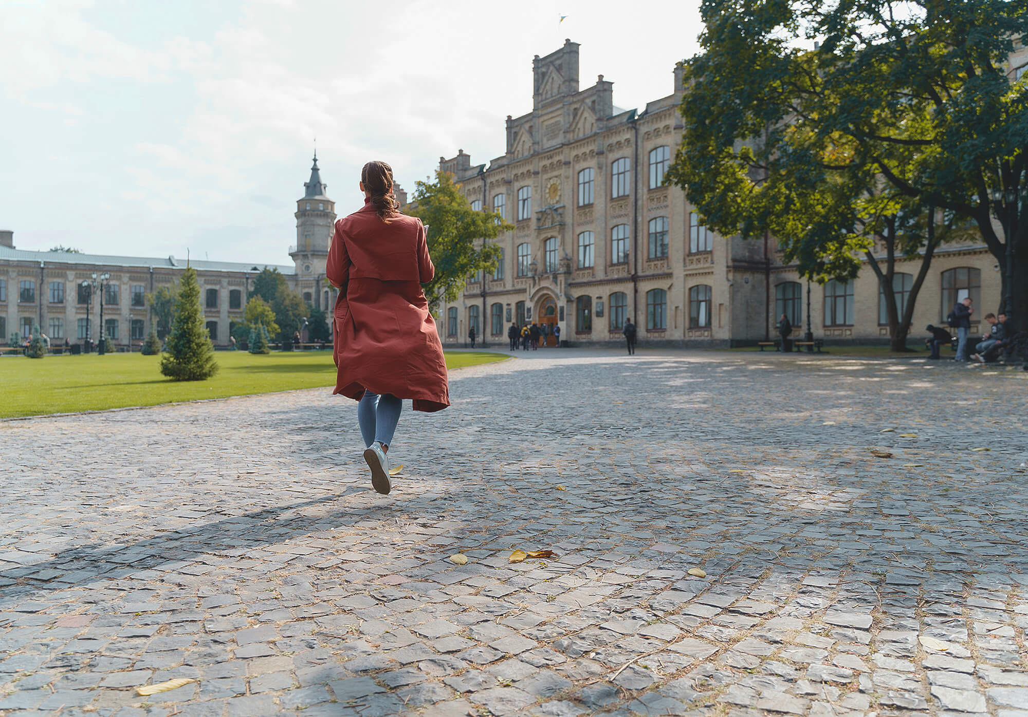 a student walks across her university campus