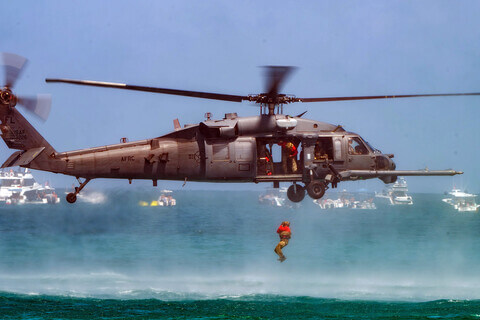 An Air Force chopped drops a swimmer into the Gulf of Mexico