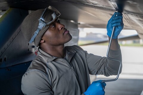 Air Force Airman fuels an airplane