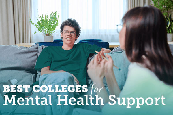 two students sit on a couch and talk in a nice sitting room