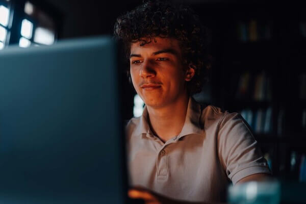a student looks at his laptop