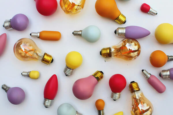 colorful light bulbs scattered on a table