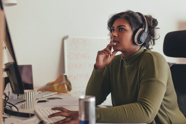 a student looks at her laptop for college majors