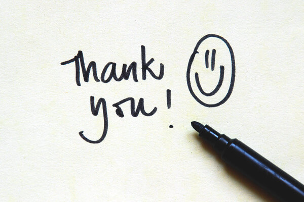 a smiley face and a thank you note