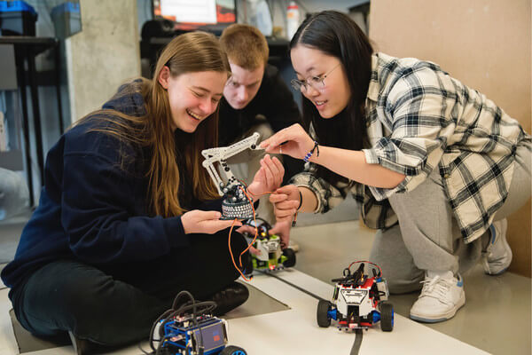 a group of students working on robotics project