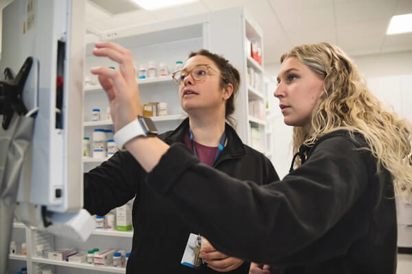 an intern works in a pharmacy