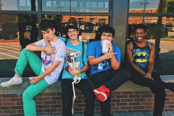 a group of boys hangs out after school