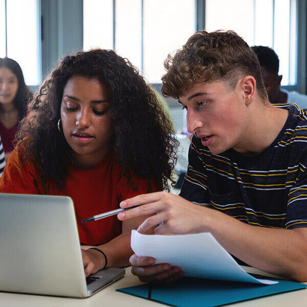 two students apply for an ROTC scholarship a laptop