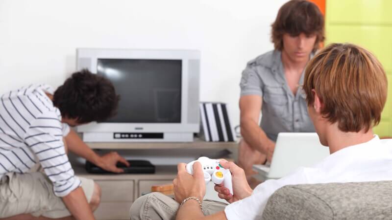 College roommates playing video games