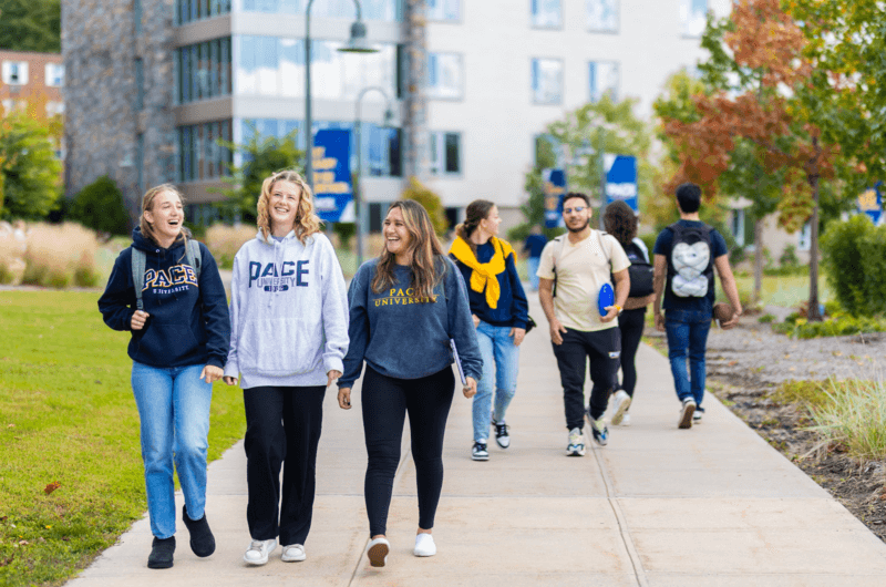 students walk through the Pace University campus