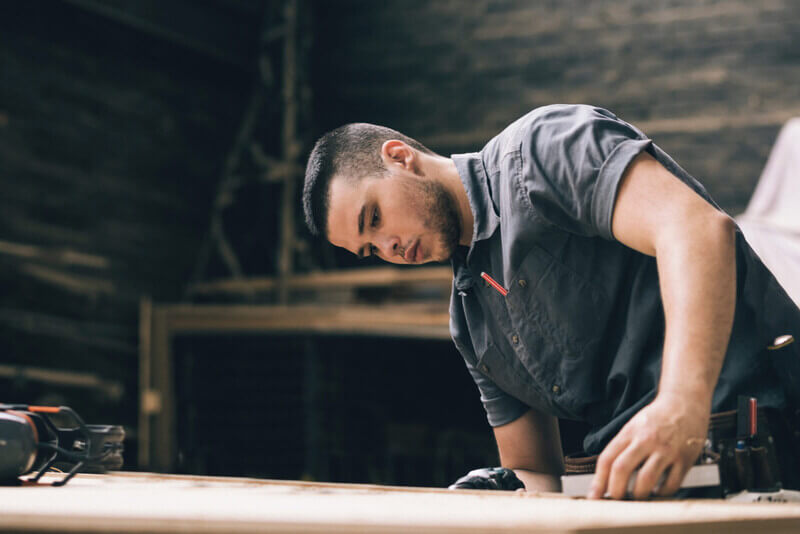 a man works at a drafting table