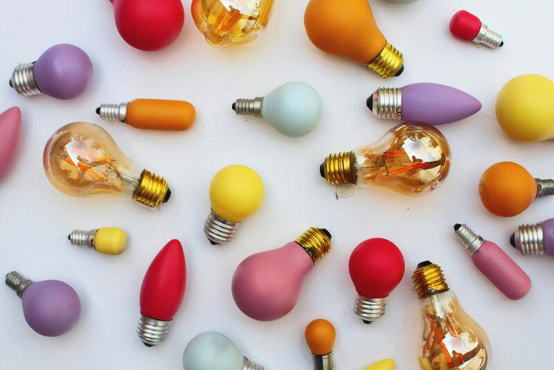 colorful light bulbs scattered on a table