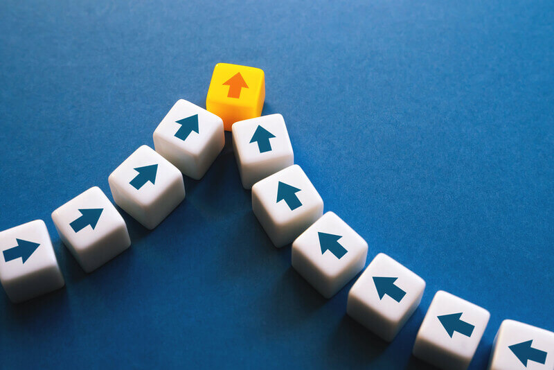 a set of arrows converge