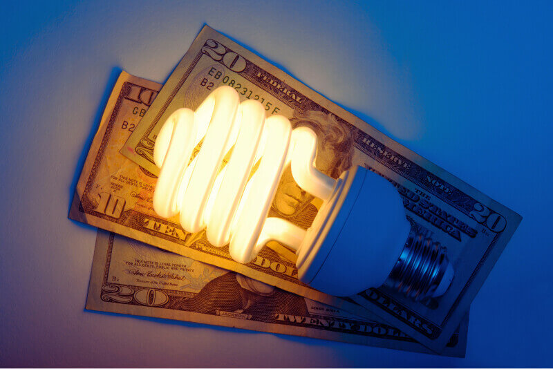 money with a lightbulb on top