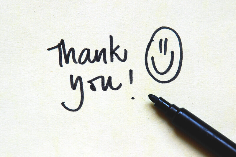 a smiley face and a thank you note