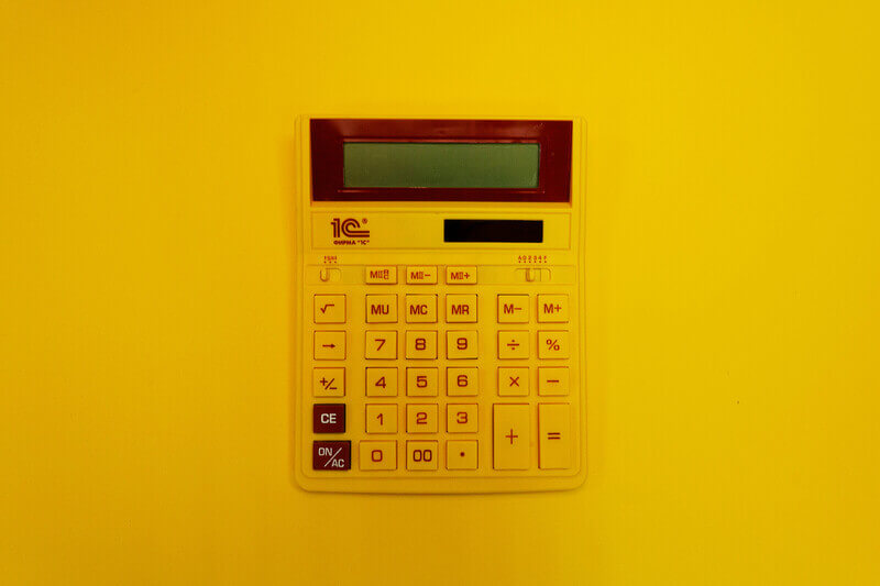 a calculator on a yellow backdrop