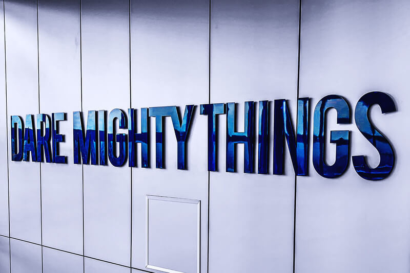 a blue sign that says dare mighty things