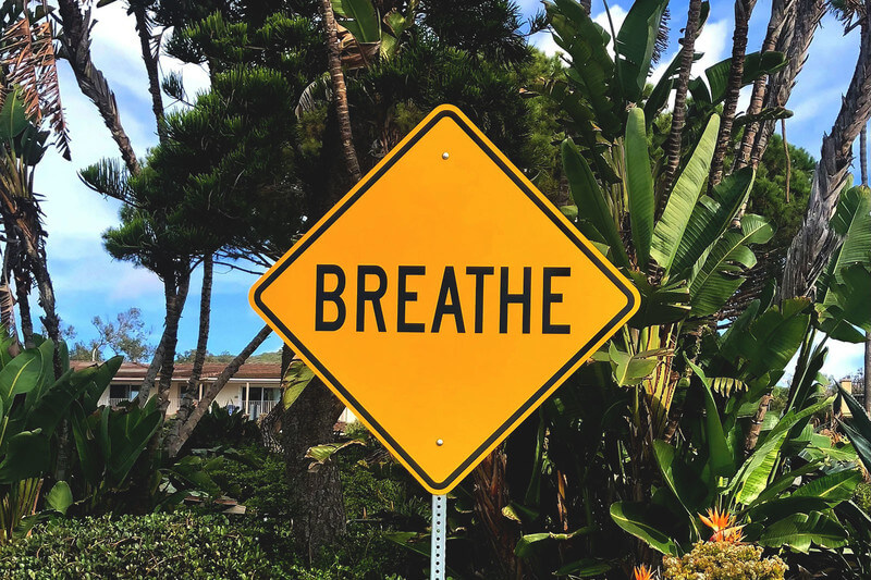 a road sign saying breathe