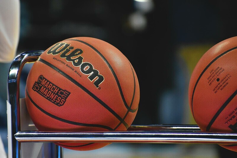 NCAA Final Four printed on basketballs on a rack