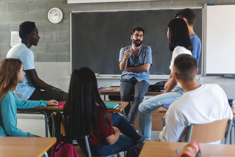 College students around the blackboard