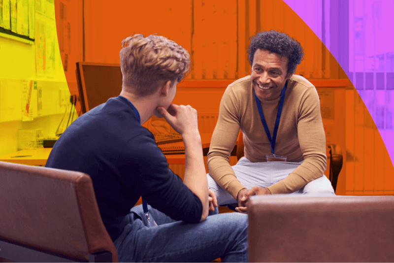 a student chats with a high school counselor