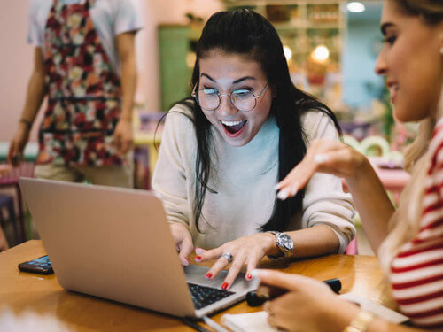 a person looking at a laptop