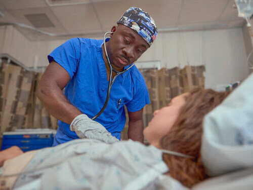 a navy nurse cares for a patient